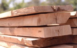 stacked lumber ready for home construction stacked lumber ready for home construction