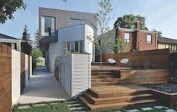 Thermory ash decking used on a home exterior Thermory ash decking used on a home exterior