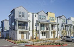 front facade of infill housing development Nova at the Vale, yellow-blue-gray color scheme front facade of infill housing development Nova at the Vale, yellow-blue-gray color scheme