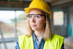 woman looking determined at construction site woman looking determined at construction site