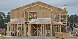single-family house being framed using timber framing single-family house being framed using timber framing