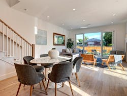 Living space in a Trademark by TJH connecting to the outdoor living area Living space in a Trademark by TJH connecting to the outdoor living area