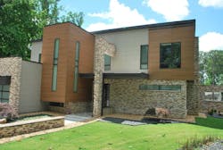 Exterior cladding of fiber-cement block panels Exterior cladding of fiber-cement block panels