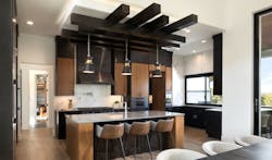 Wood tones with black provide texture and drama in this kitchen Wood tones with black provide texture and drama in this kitchen