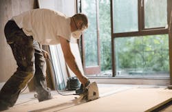 Wearing mask on construction jobsite to protect against airborne dust hazards Wearing mask on construction jobsite to protect against airborne dust hazards