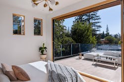 Luminosa custom home owner's suite opening to private deck Luminosa custom home owner's suite opening to private deck