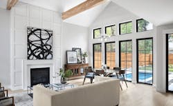 Living room view to the pool in a modern farmhouse-style home in Austin, Texas Living room view to the pool in a modern farmhouse-style home in Austin, Texas