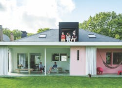 One example of reinventing home building: Exterior view of G-Lab house in Bruges with occupants enjoying upstairs and downstairs One example of reinventing home building: Exterior view of G-Lab house in Bruges with occupants enjoying upstairs and downstairs