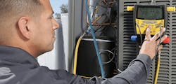 Technician testing for HVAC faults so HVAC system performance isn't compromised Technician testing for HVAC faults so HVAC system performance isn't compromised