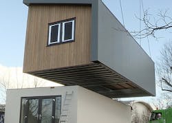 crane lifts module to build Solar Decathlon home crane lifts module to build Solar Decathlon home