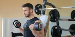 man exercising in home gym man exercising in home gym