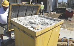 steel bin on construction site for collecting paint and plaster slurry steel bin on construction site for collecting paint and plaster slurry