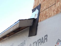 Lower course housewrap tucked under fascia flashing ​ Lower course housewrap tucked under fascia flashing ​