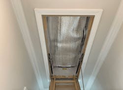 Insulated attic stair cover installed for better home insulation Insulated attic stair cover installed for better home insulation