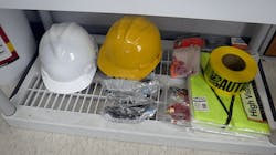 Construction PPE (personal protective equipment) on shelf in jobsite trailer Construction PPE (personal protective equipment) on shelf in jobsite trailer