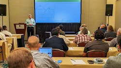 Man presenting during professional conference Man presenting during professional conference