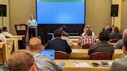 Man presenting during professional conference Man presenting during professional conference