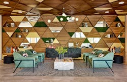 Soothing Emerald Toned Lounge Chairs Contrast The Bold Backdrop In This Main Entry Lobby To Elevate The Impact At Arrival Soothing Emerald Toned Lounge Chairs Contrast The Bold Backdrop In This Main Entry Lobby To Elevate The Impact At Arrival