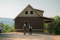 Perkins Builder Brothers in front of house Perkins Builder Brothers in front of house
