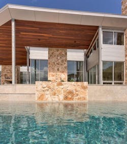 Petersen Aluminum Carson Design Associates Texas Hill Country Modern House View across the pool Petersen Aluminum Carson Design Associates Texas Hill Country Modern House View across the pool
