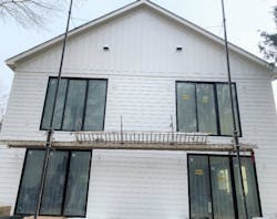 Rear view of SYMBI Duplex One featuring Allura’s lap siding, board-and-batten, trim and soffit fiber cement material Rear view of SYMBI Duplex One featuring Allura’s lap siding, board-and-batten, trim and soffit fiber cement material