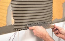 Schluter Systems Stainless steel shelf install 1 Schluter Systems Stainless steel shelf install 1