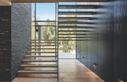 Shou sugi ban and dark brick walls in the staircase of the Burch Creek Home, a 2023 BALA winner Shou sugi ban and dark brick walls in the staircase of the Burch Creek Home, a 2023 BALA winner