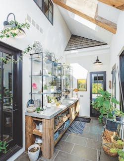 An bright, enclosed breezeway meets the homeowner's garden needs An bright, enclosed breezeway meets the homeowner's garden needs