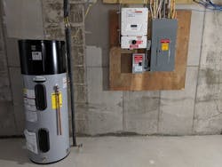 A Heat Pump Water Heater Is Housed In The Basement Next To Solar Photovoltaic (pv) Equipment A Heat Pump Water Heater Is Housed In The Basement Next To Solar Photovoltaic (pv) Equipment