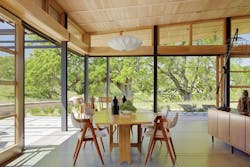 Open glass doors merge indoor and outdoor living Open glass doors merge indoor and outdoor living