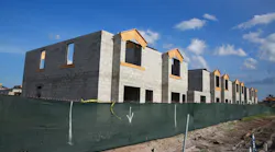 A row of townhomes sit under construction