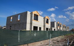 A row of townhomes sit under construction A row of townhomes sit under construction