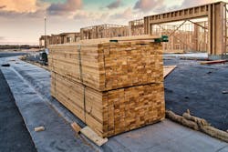 Stack of lumber on a jobsite for the construction of new homes. Stack of lumber on a jobsite for the construction of new homes.