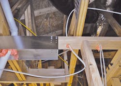 Your quality assurance team shouldn't assume that just because there's spray foam protruding (as this photo shows) from an electrical penetration in the top plate that the hole is completely sealed. Close inspection will likely reveal an open path for air to move from the attic to the conditioned spaces of the home. Your quality assurance team shouldn't assume that just because there's spray foam protruding (as this photo shows) from an electrical penetration in the top plate that the hole is completely sealed. Close inspection will likely reveal an open path for air to move from the attic to the conditioned spaces of the home.