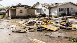 A home with roof damage from a tornado A home with roof damage from a tornado