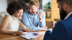 Young couple speaks with real estate agent about homebuying process