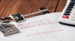 A mortgage application with a house key and calculator