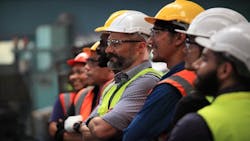 Construction workers standing in a line Construction workers standing in a line
