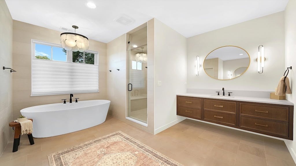 Bathroom with large free-standing tub and floating vanity