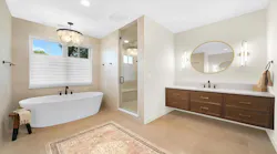 Bathroom with large free-standing tub and floating vanity