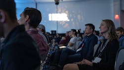 Attendees watch an IBS Education presentation Attendees watch an IBS Education presentation