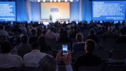 Audience watches IBS Education session presentation Audience watches IBS Education session presentation