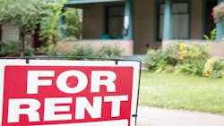 A single-family rental home with a 'For Rent' sign in front A single-family rental home with a 'For Rent' sign in front
