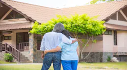 An empty nester couple admiring their home