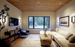 Adjacent to the bunk room, a lounge—one of several “quiet places” away from the wide-open common living spaces—rounds out one wing, while another two bedroom suites, a media room, and a steam room are located between the great room and the primary suite and office sections of the home. “A lot of our early work is in true partnership with the architectural firm to talk bigger picture about how the home’s daily use in intended,” says interior designer Sydney Piwowar. “What we’re trying to do is tap into why we make certain decisions that will feel good and provide a healthier, more fulfilling lifestyle for the homeowners.” Adjacent to the bunk room, a lounge—one of several “quiet places” away from the wide-open common living spaces—rounds out one wing, while another two bedroom suites, a media room, and a steam room are located between the great room and the primary suite and office sections of the home. “A lot of our early work is in true partnership with the architectural firm to talk bigger picture about how the home’s daily use in intended,” says interior designer Sydney Piwowar. “What we’re trying to do is tap into why we make certain decisions that will feel good and provide a healthier, more fulfilling lifestyle for the homeowners.”