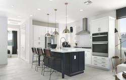 Juniper at Rienda kitchen with an island and black and white palette. Juniper at Rienda kitchen with an island and black and white palette.