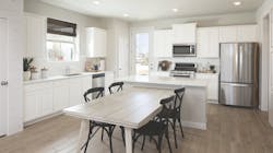 Courtyard Homes at Easton Park kitchen with island seating Courtyard Homes at Easton Park kitchen with island seating