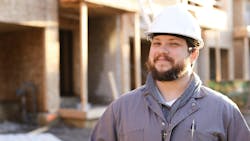 Smiling home builder looks optimistic about his prospects in the coming year Smiling home builder looks optimistic about his prospects in the coming year