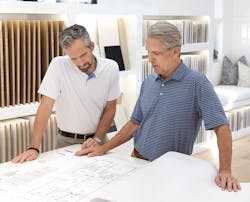 Camelot Homes Trent and Mark Hancock reviewing house plans together Camelot Homes Trent and Mark Hancock reviewing house plans together