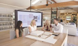 Camelot Homes design center team meets with homeowners to discuss their design Camelot Homes design center team meets with homeowners to discuss their design